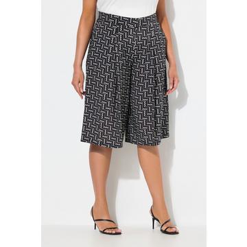 Jupe-culotte courte. Jambe large et taille confortable. Tissu à texture « martelée »