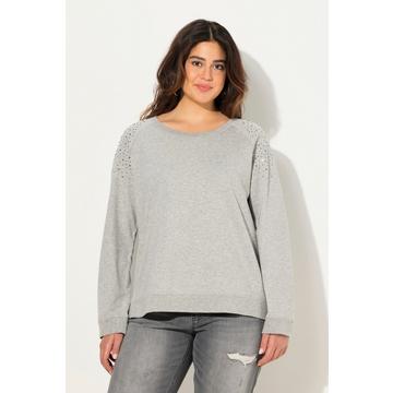 Sweat-shirt oversize, col rond et manches longues. Rivets fantaisie.