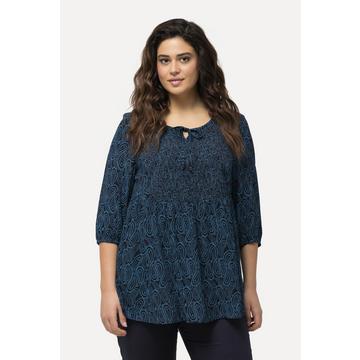 Blouse smockée avec encolure ronde et manches 3/4. Ligne A