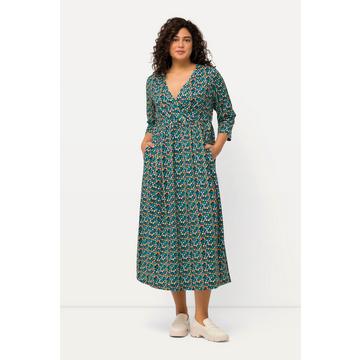 Robe en jersey, effet cache-cœur. Imprimé points multicolores. Col en V et manches 3/4.