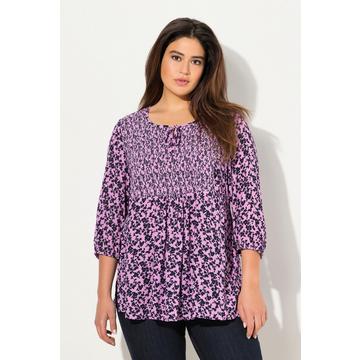 Blusa a punto smock con design floreale, taglio svasato, scollo a girocollo e maniche a 3/4