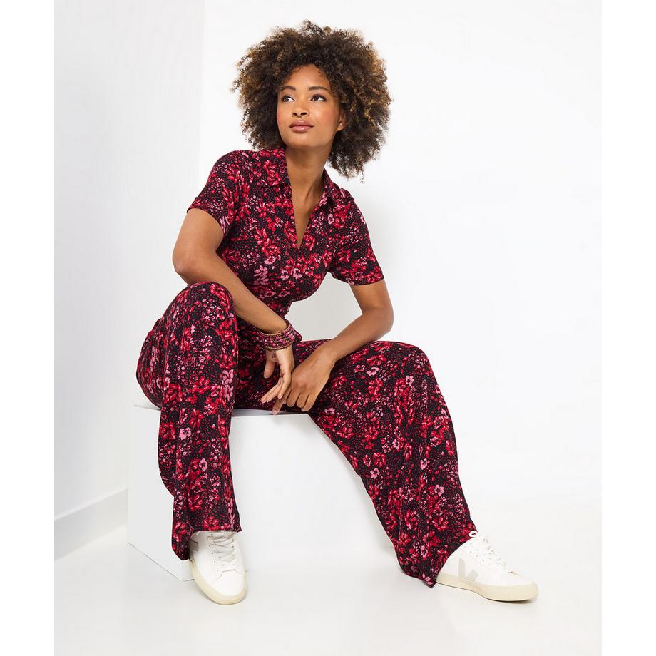 Dunkler geblümter Jumpsuit mit Reißverschluss