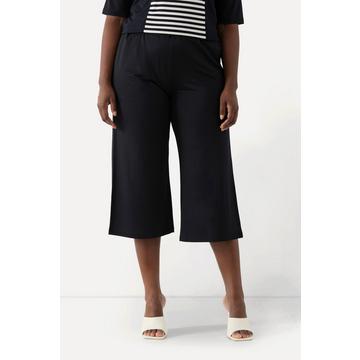 Jupe-culotte longueur mollet, tissu fluide. Jambe large et taille élastique.