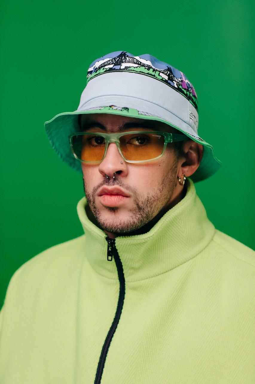 Bad Bunny in front of a green background