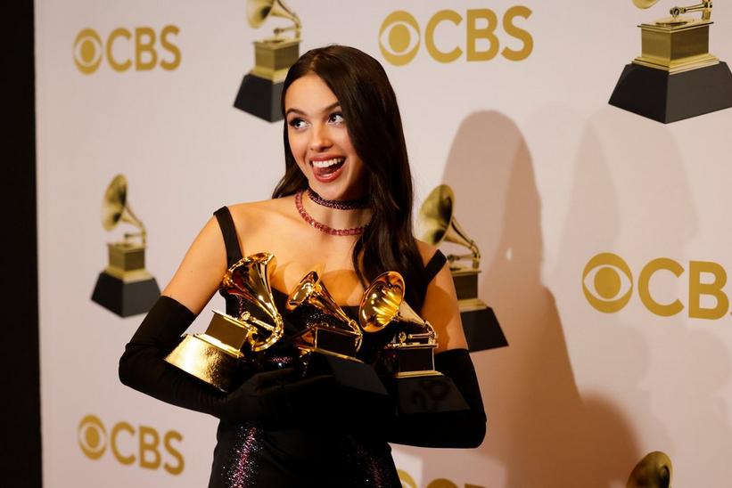 Watch Olivia Rodrigo, Jazmine Sullivan, Doja Cat & More GRAMMY Winners Pose With Their Golden Gramophones In The Backstage Portrait Cam