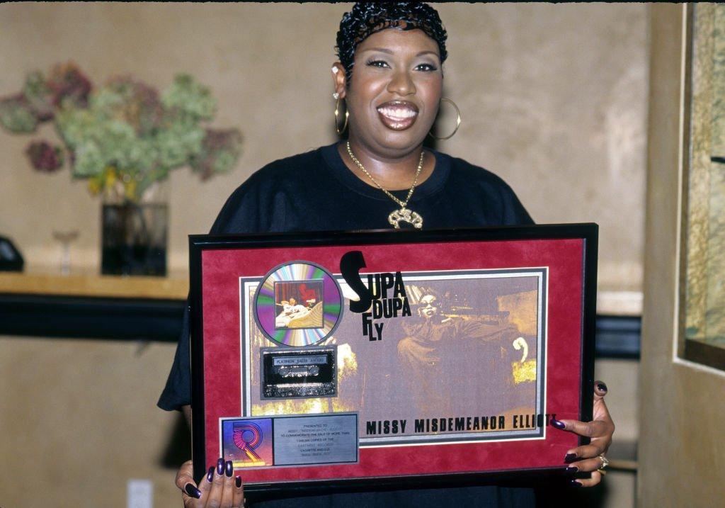 Photo of Missy Elliott holding awards from 'Supa Dupa Fly' in  1997