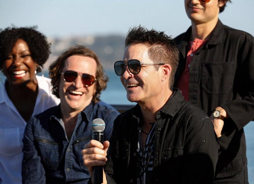 Nikita Houston, Jerry Becker, and Pat Monahan of diamond-selling and multi-Grammy Award-winning band, Train performs on stage in San Francisco for A Capitol Fourth