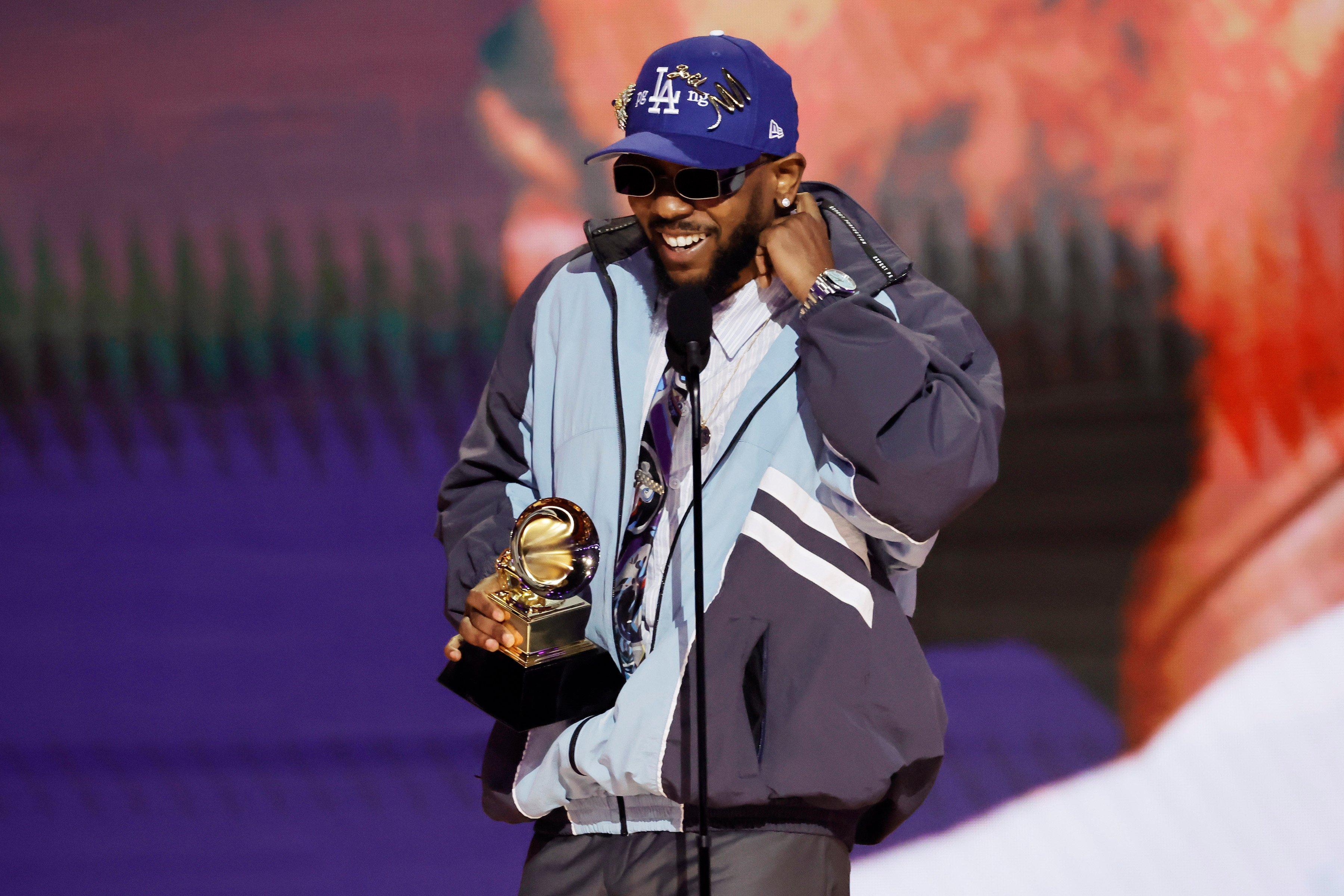 Photo of Kendrick Lamar winning the GRAMMY for Best Rap Album at the 2023 GRAMMYs.