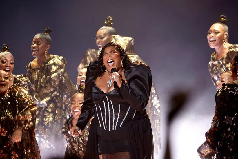 Lizzo Celebrates in Silver Dress & Flower Heels at Grammy Awards 2023