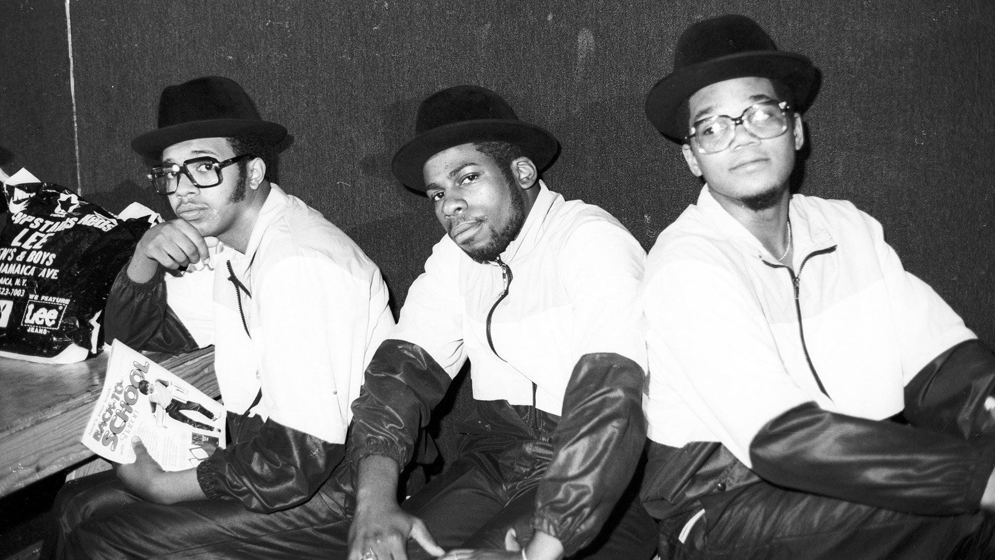 A black-and-white photo of pioneering rap group Run-DMC