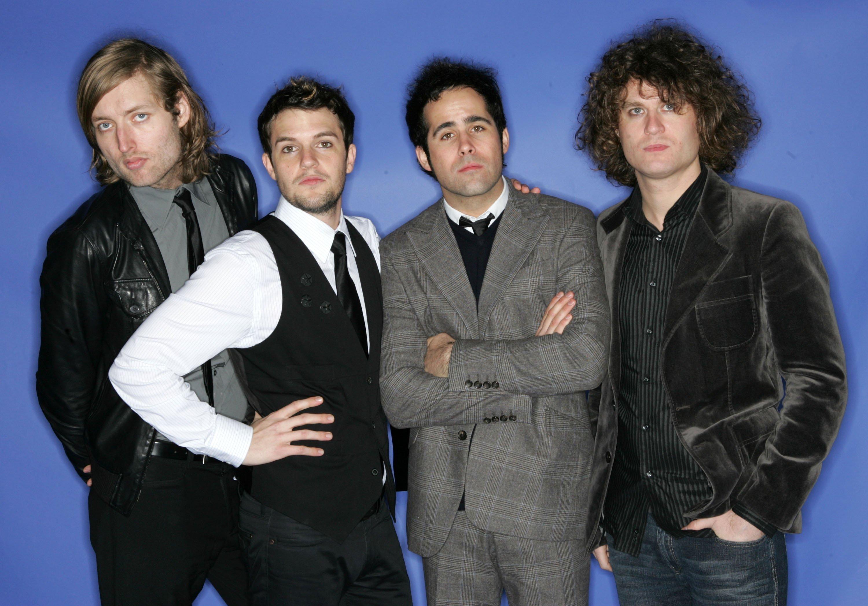 Musicians Mark Stoermer, Brandon Flowers, Ronnie Vannucci and David Keuning of The Killers poses for a portrait during the 2004 Billboard Music Awards at the MGM Grand Garden Arena on December 8, 2004 in Las Vegas, Nevada.