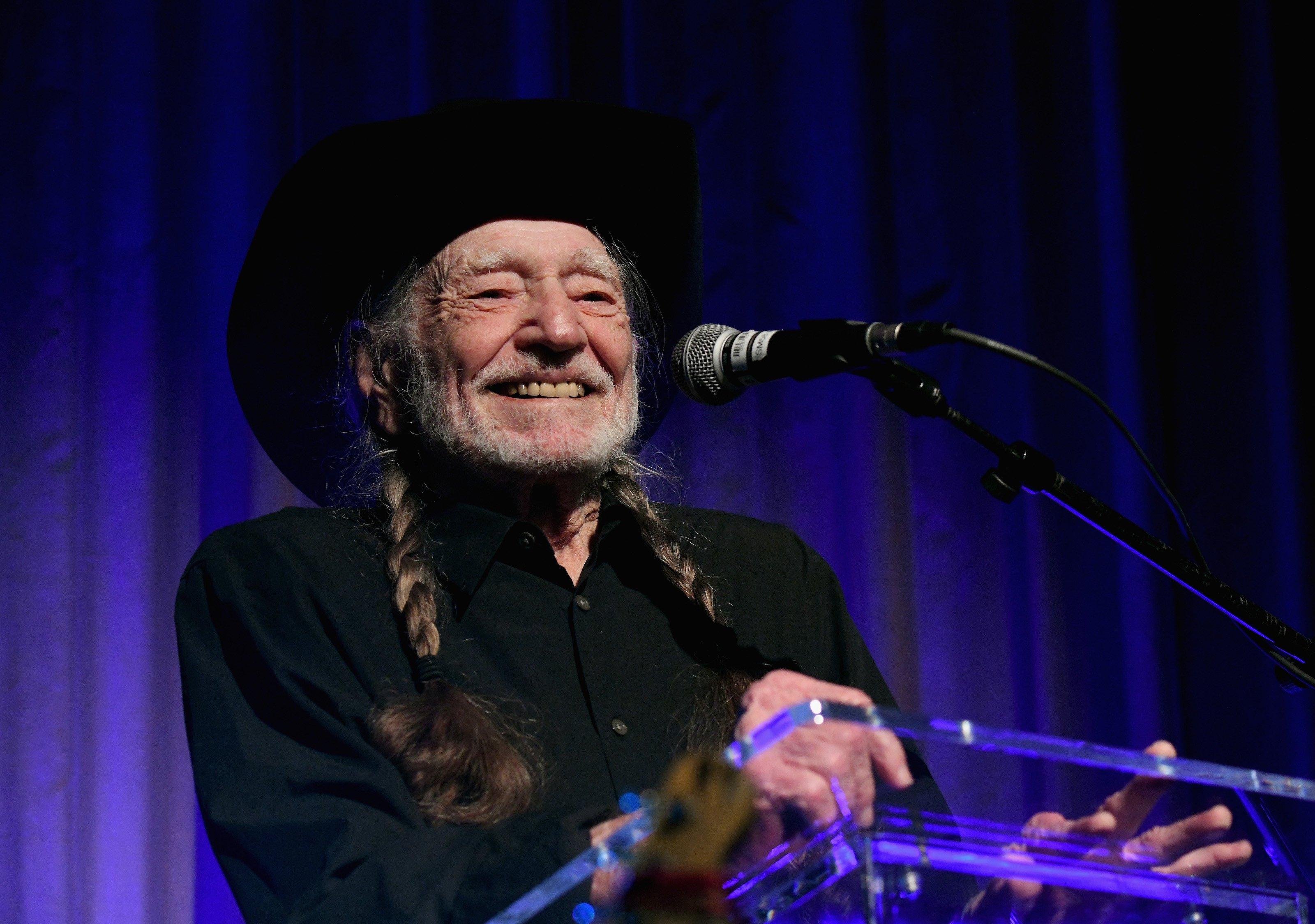 Photo of Willie Nelson winning the GRAMMY for Best Country Album at the 2023 GRAMMYs.