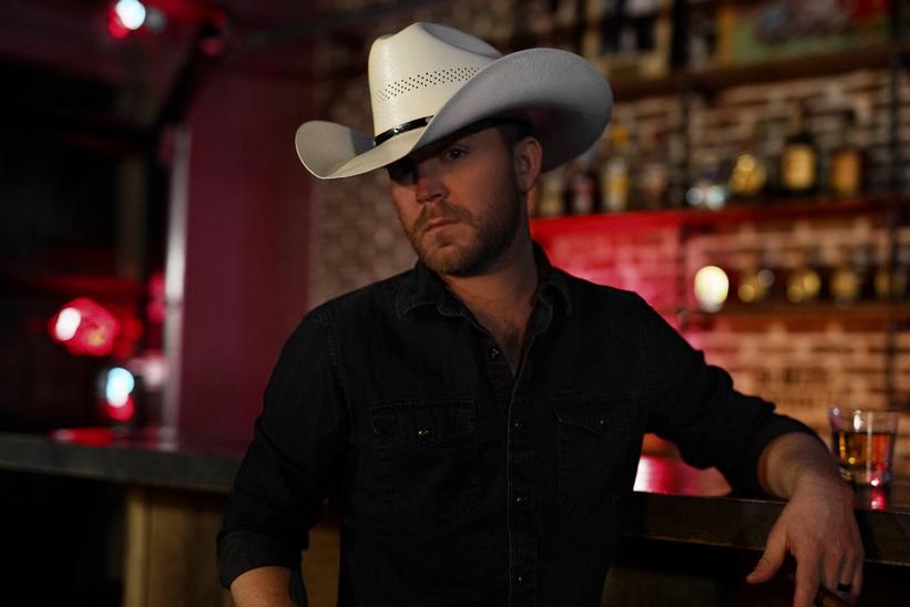 Watch: Justin Moore Takes Vocals To The Next Level In "On The Rocks" Video