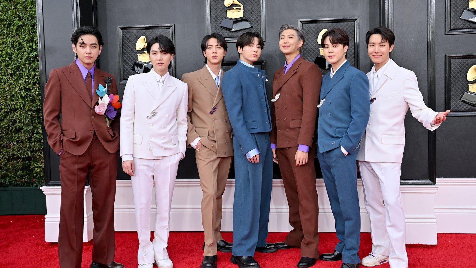Photo of (L-R) V, Suga, Jin, Jungkook, RM, Jimin and J-Hope of BTS attending the 2022 GRAMMYs, aka the 64th Annual GRAMMY Awards, at MGM Grand Garden Arena on April 03, 2022 in Las Vegas, Nevada