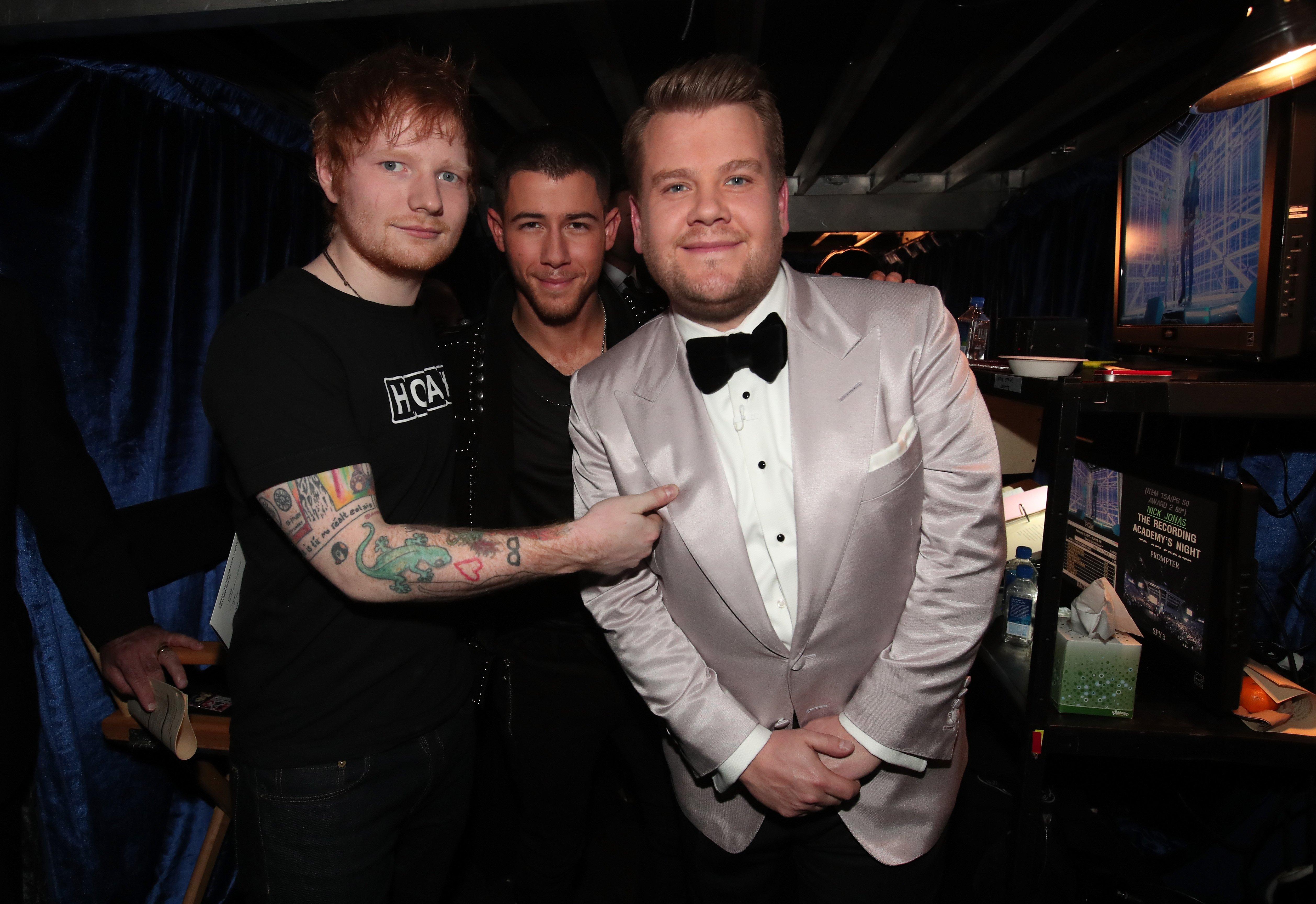 Ed Sheeran Nick Jonas And James Corden standing backstage