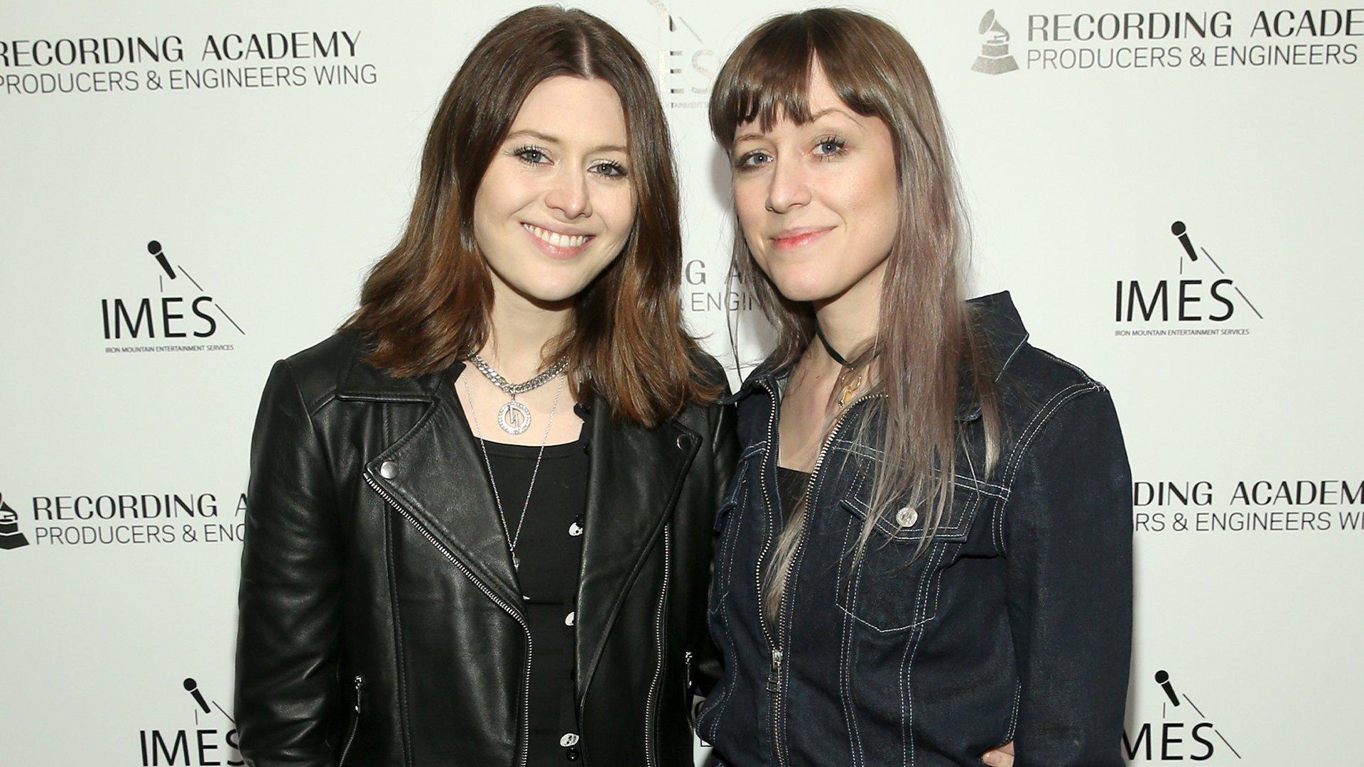 Larkin Poe pose at a Recording Academy event