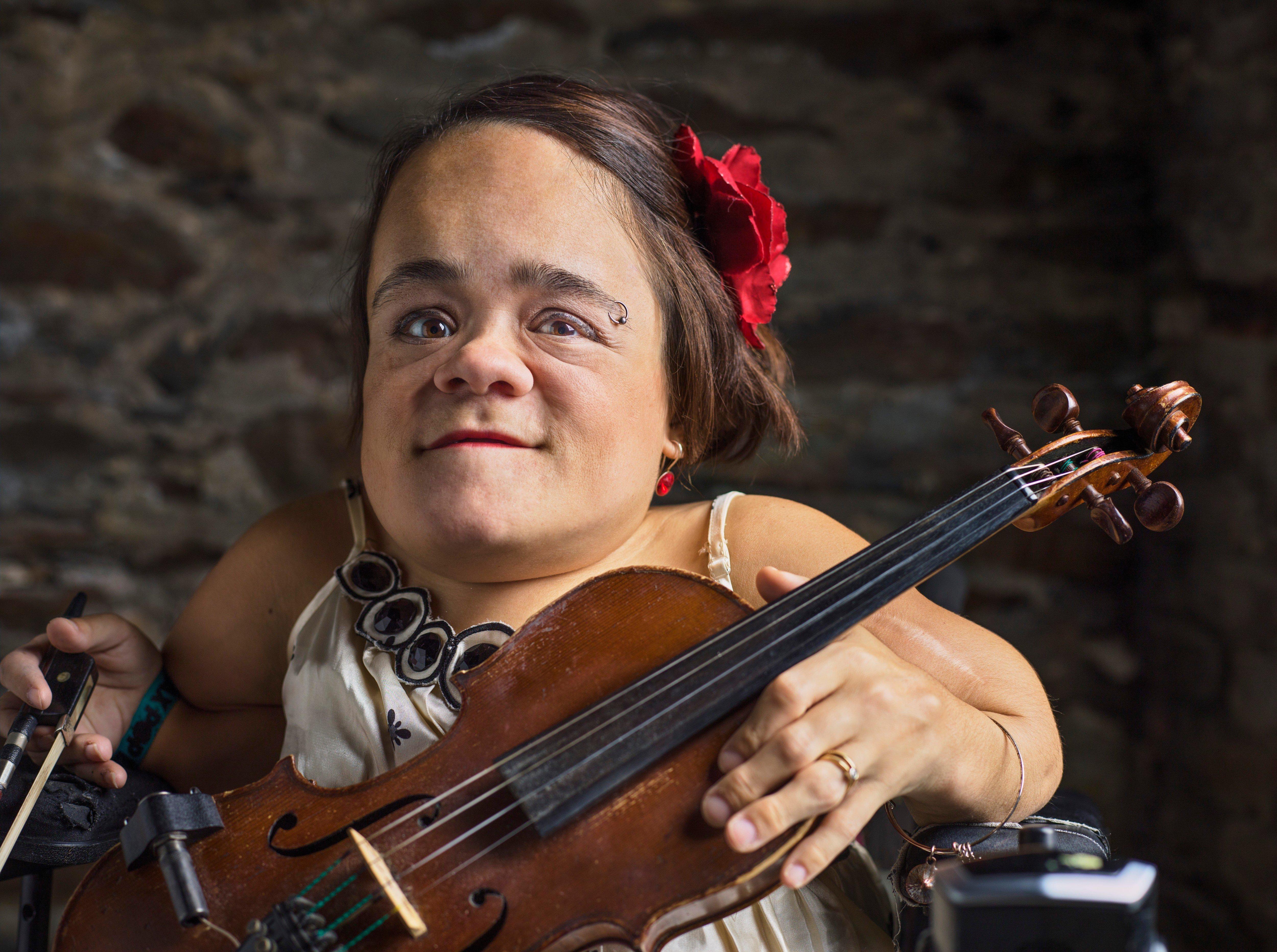 Gaelynn Lea smiles with her violin 