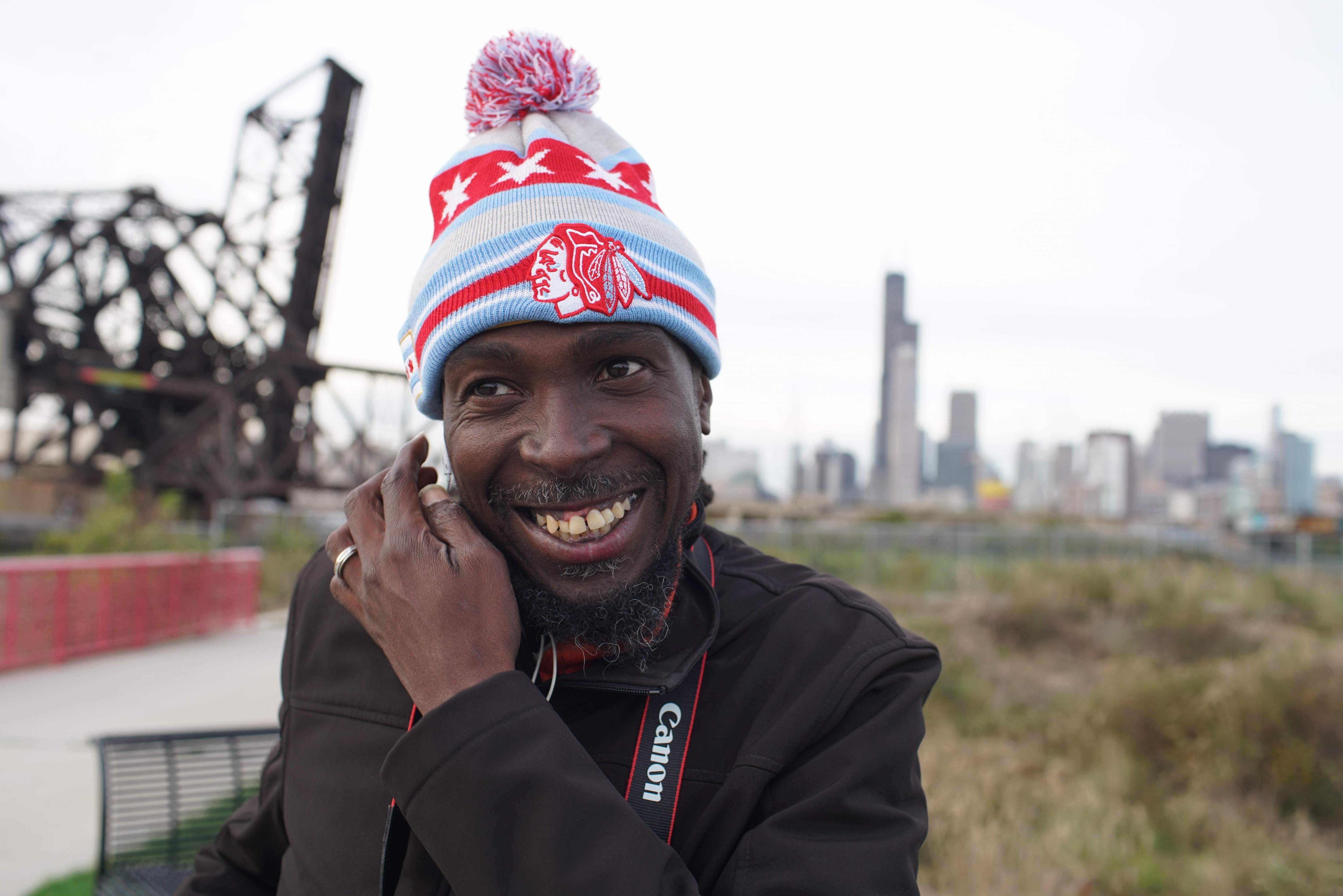 RP Boo smiles in front of Chicago skyline