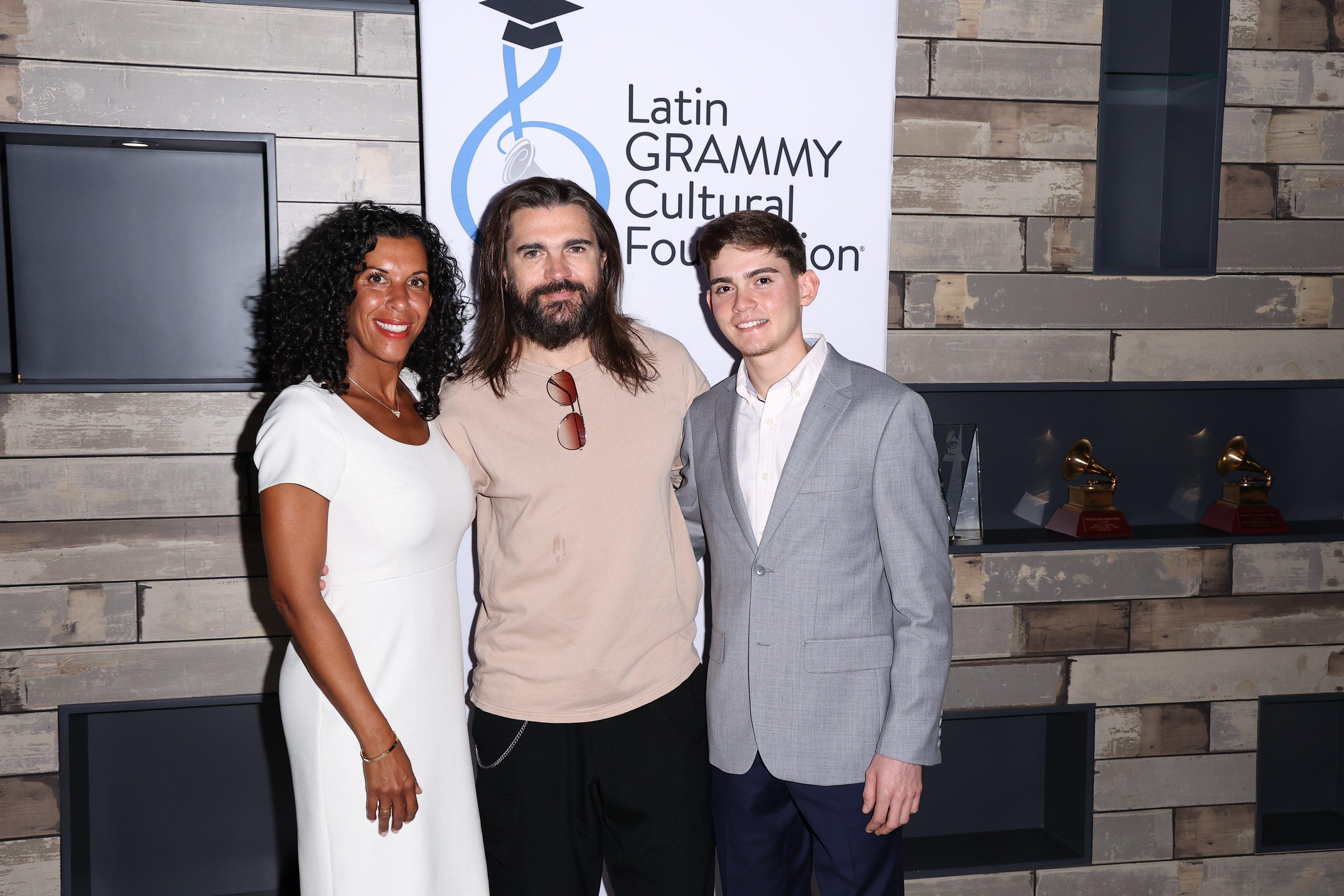 Photo of Tanya Ramos-Puig, Juanes and Xavier Cintrón
