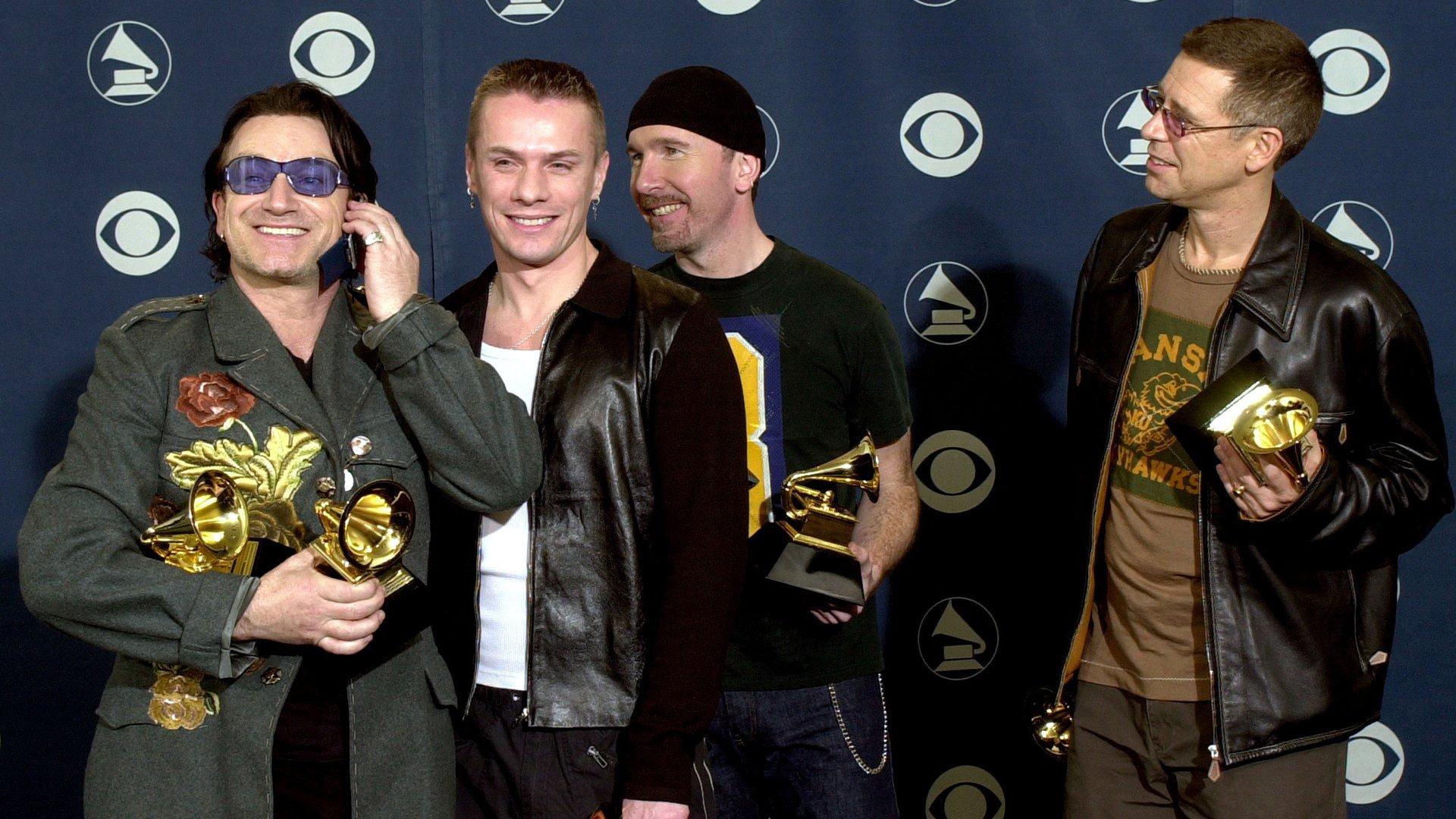  U2 pose with GRAMMYs backstage at the 43rd GRAMMY Awards in 2001