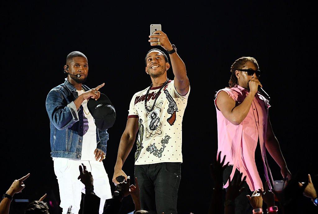 (L-R) Usher, Ludacris and Lil Jon perform at the 2016 iHeartRadio Music Festival
