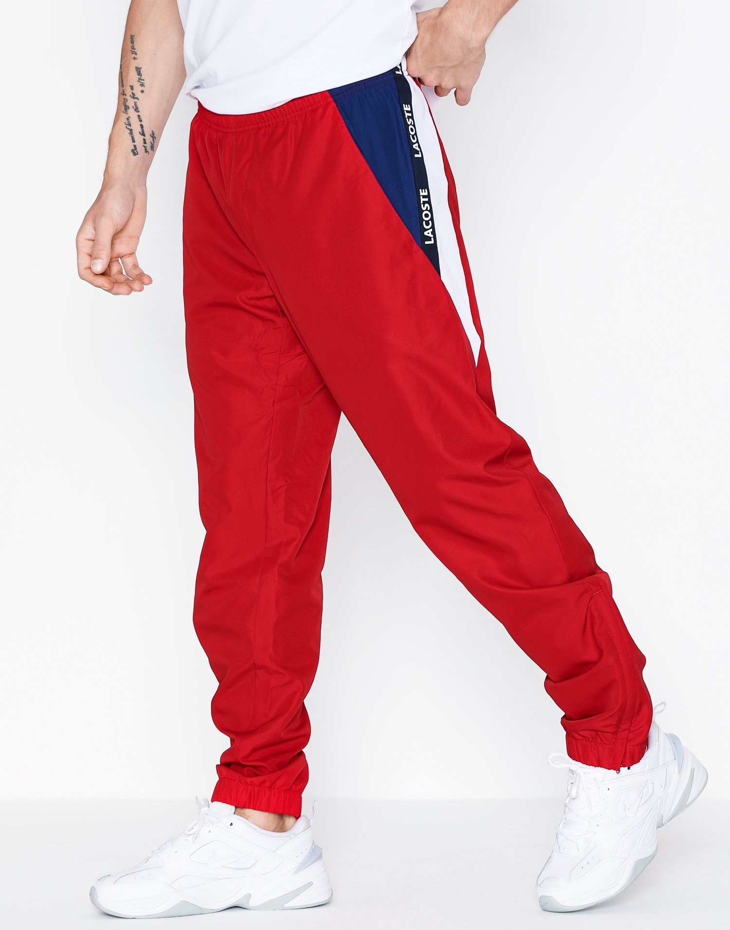 red lacoste pants