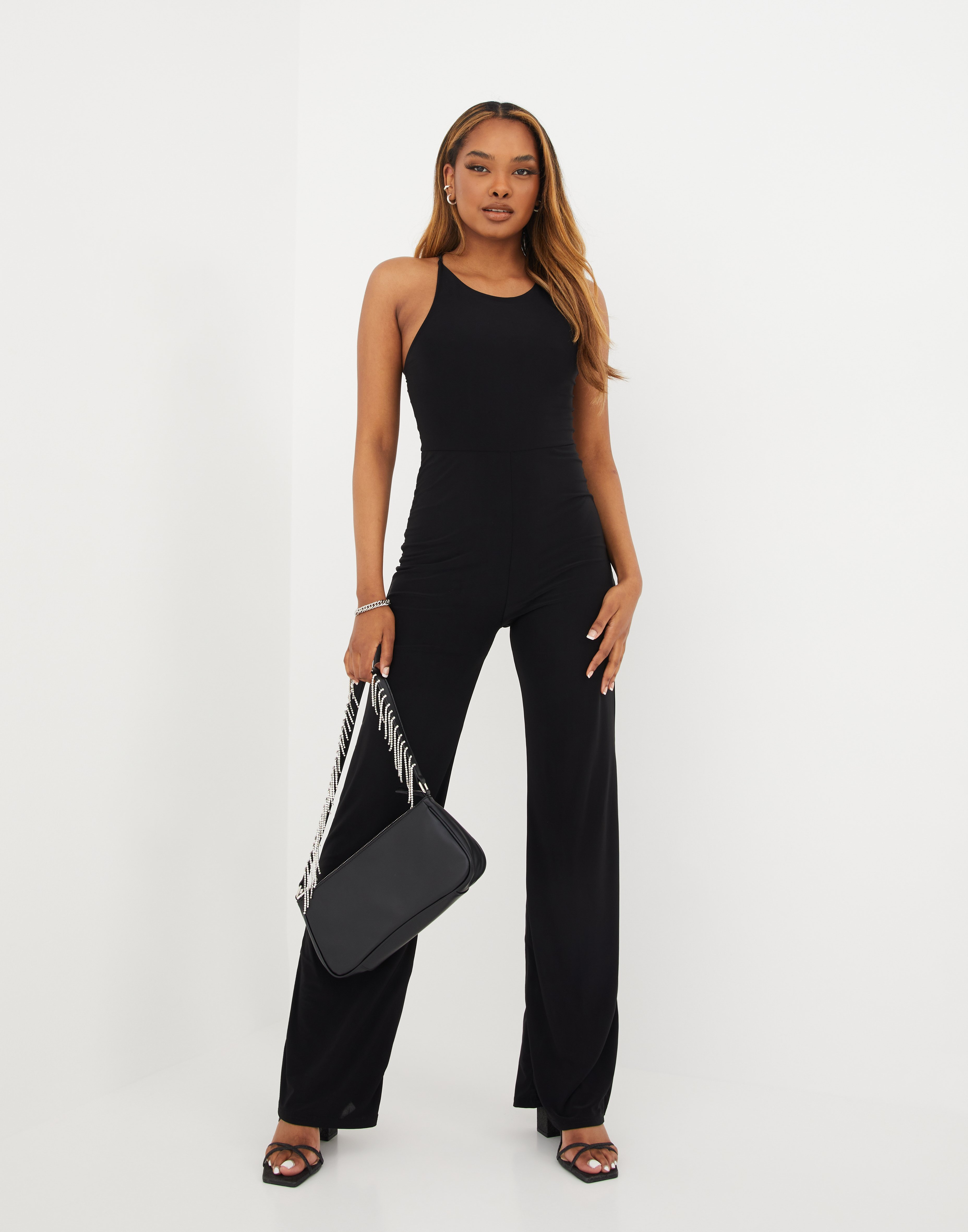 black sleeveless jumpsuit outfit