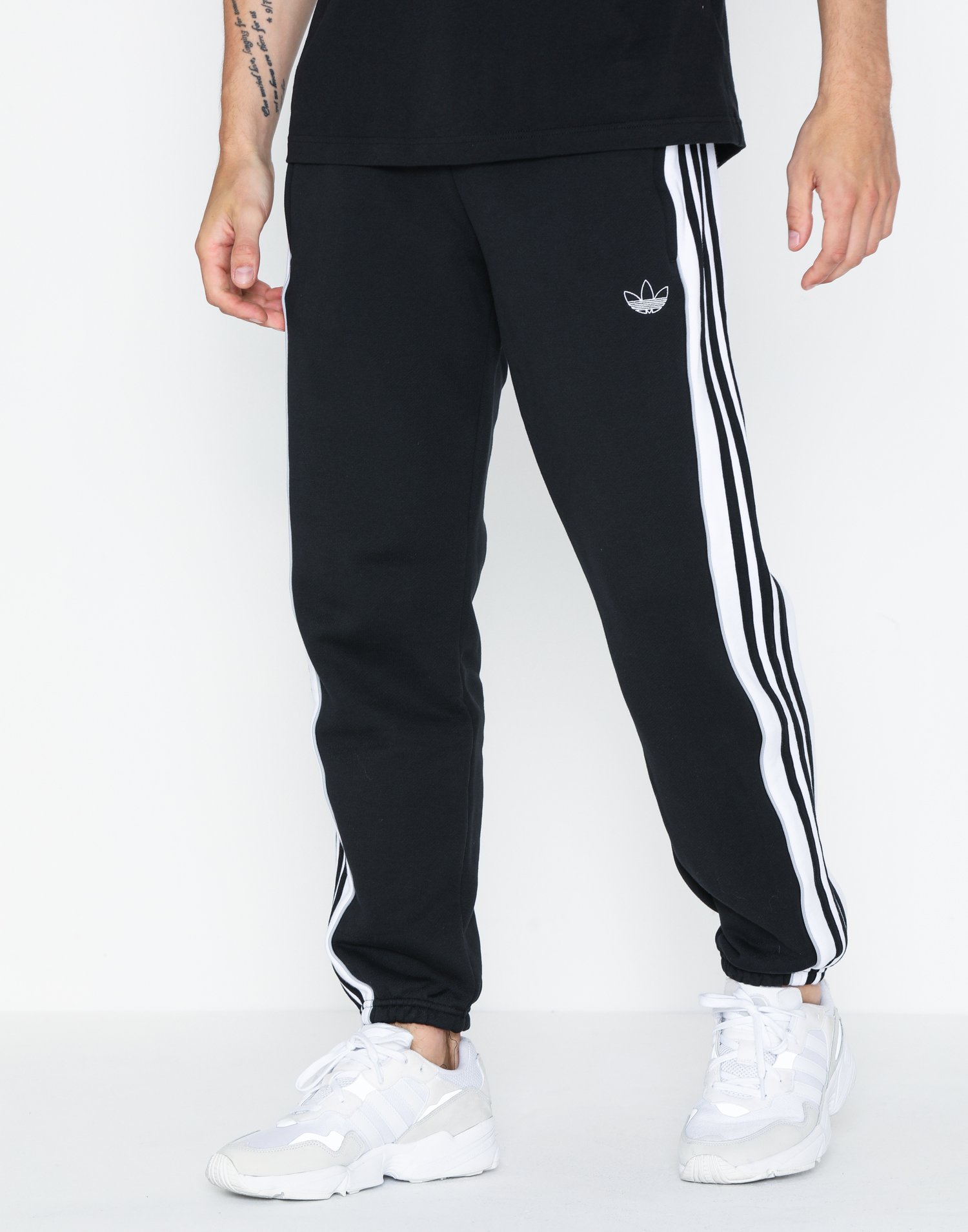 the brand with the 3 stripes pants