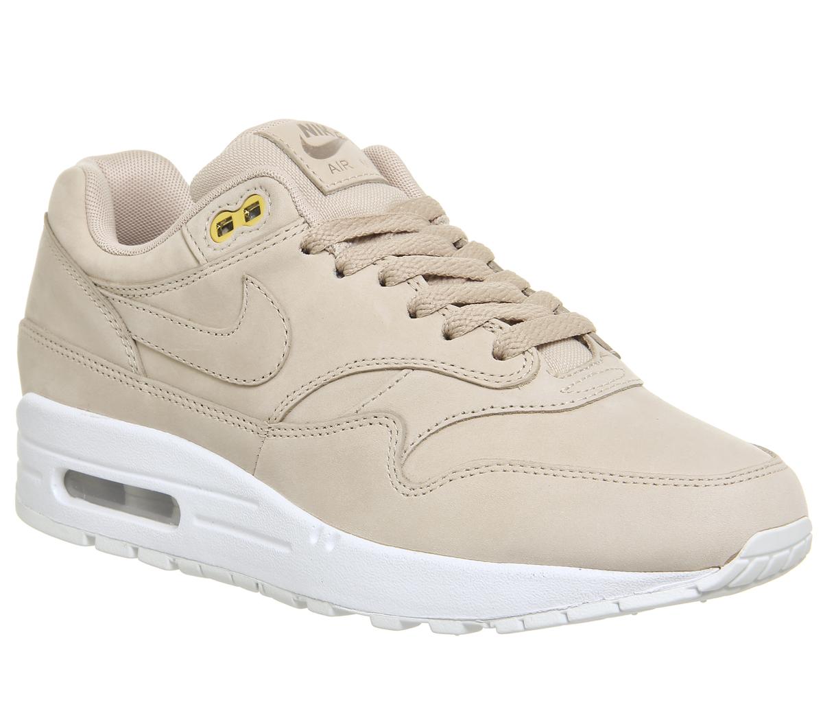 white and beige trainers