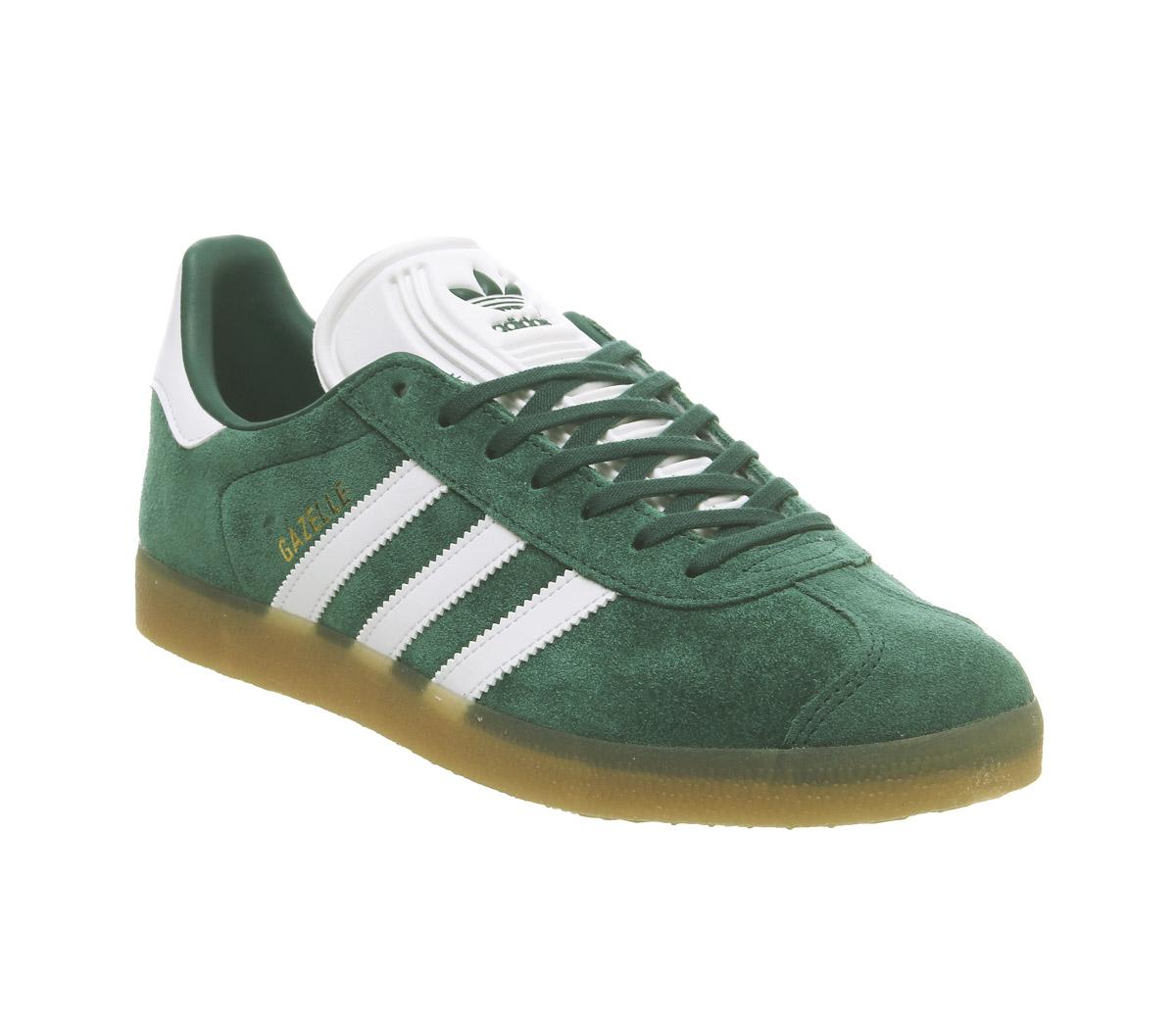 white and green adidas trainers