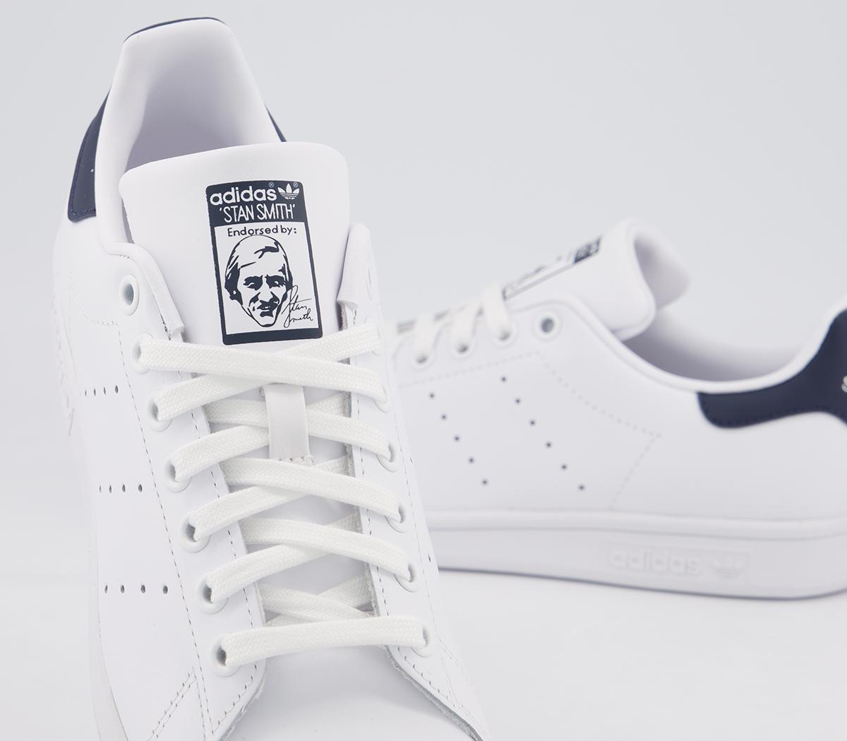 white and blue stan smiths