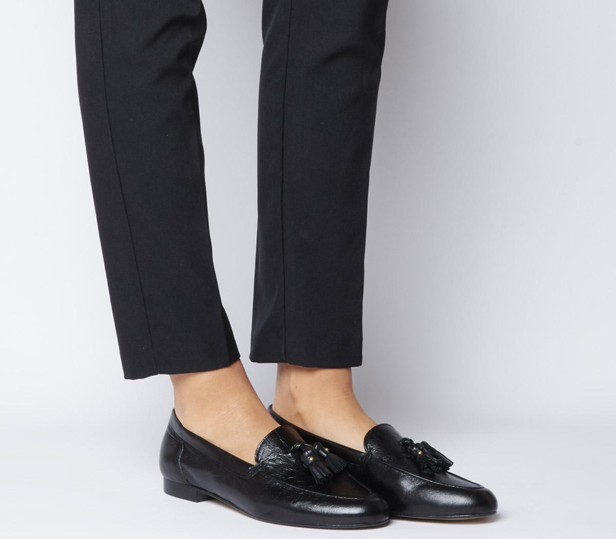 black loafers with tassels