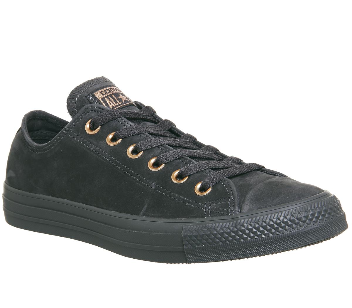 black converse with gold eyelets