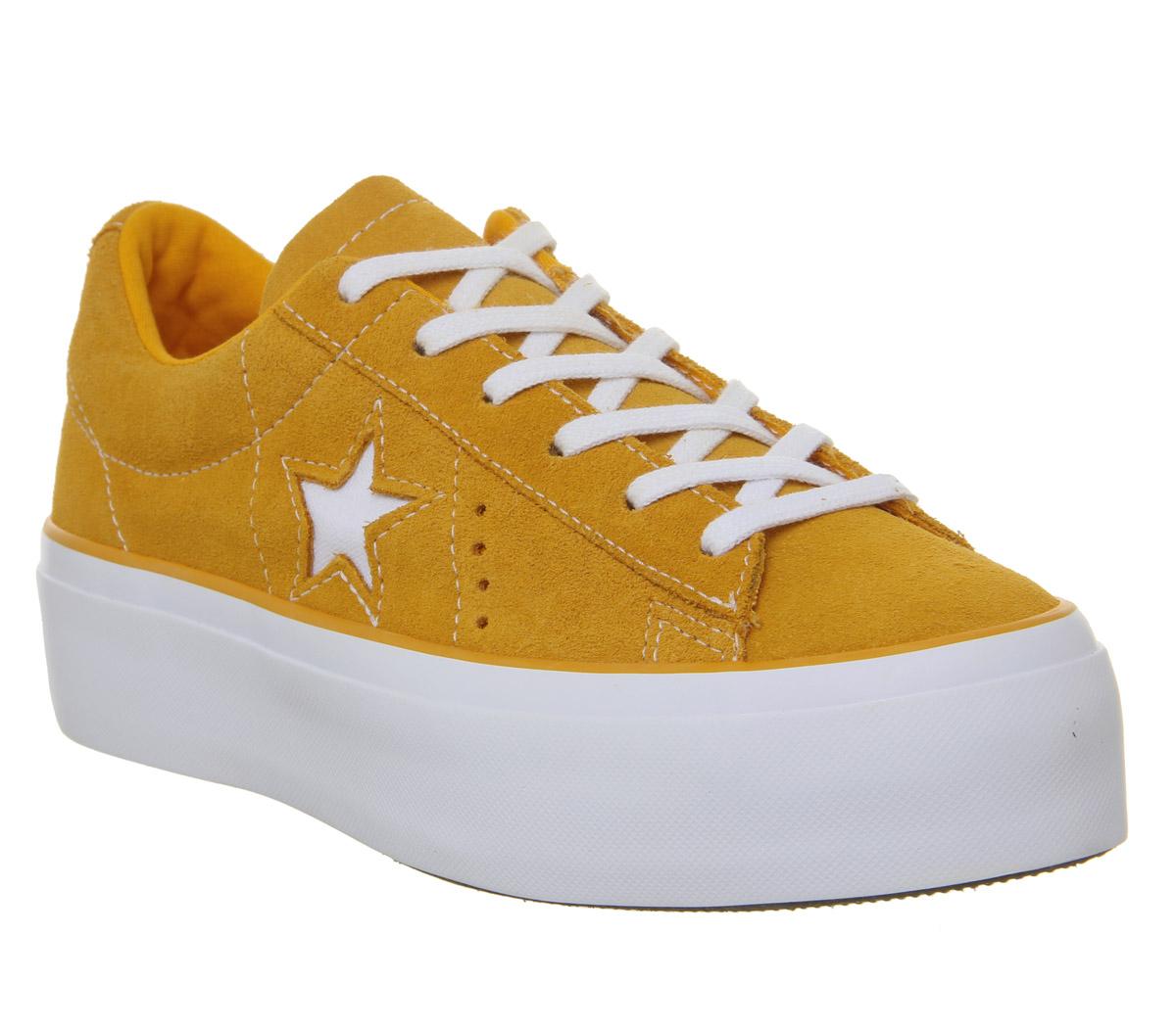 white trainers with star on side