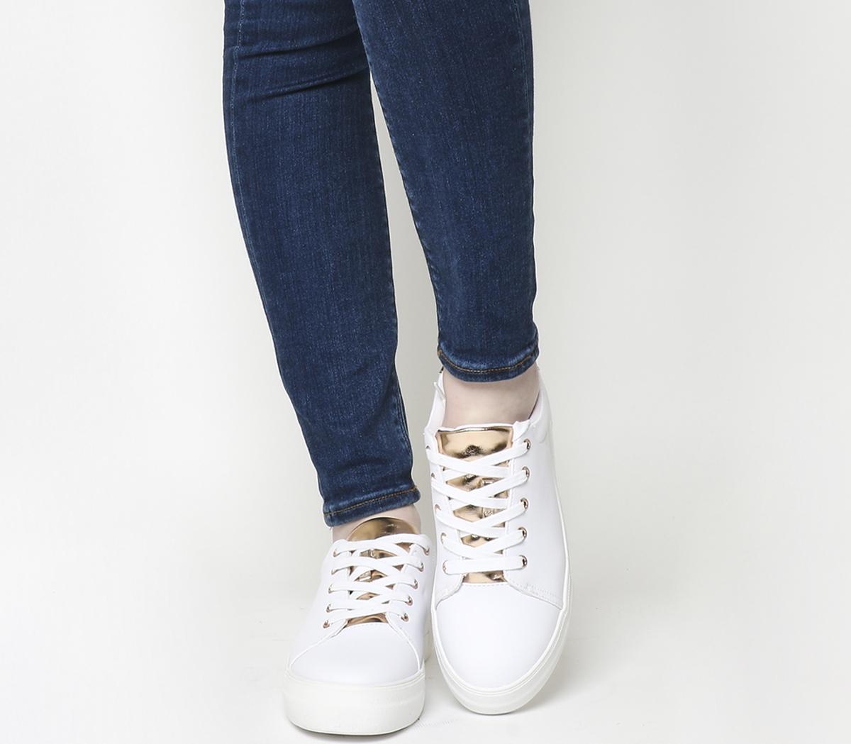 white and gold flatforms