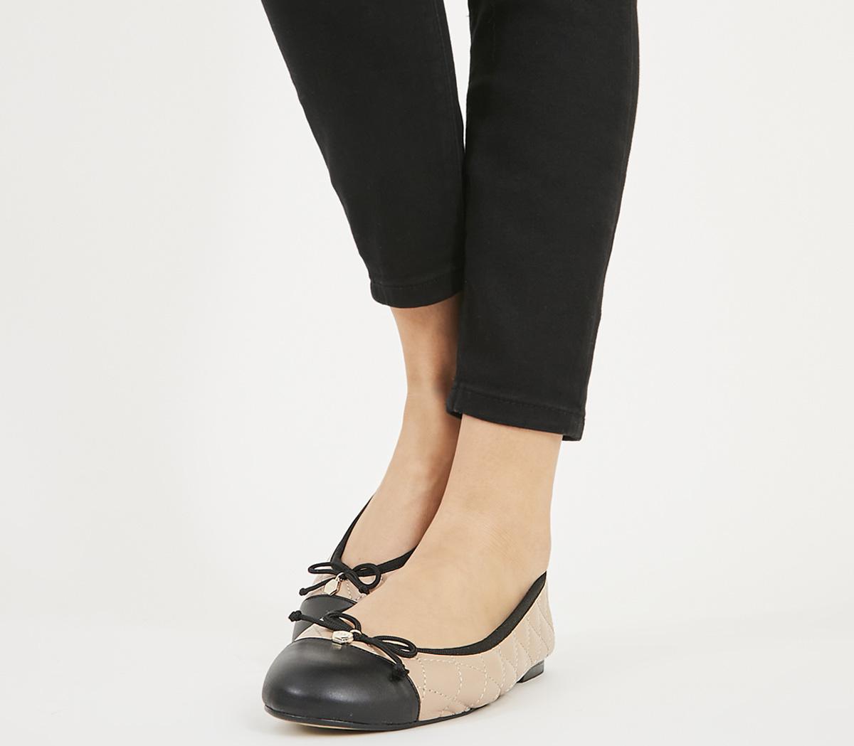 nude and black ballet flats