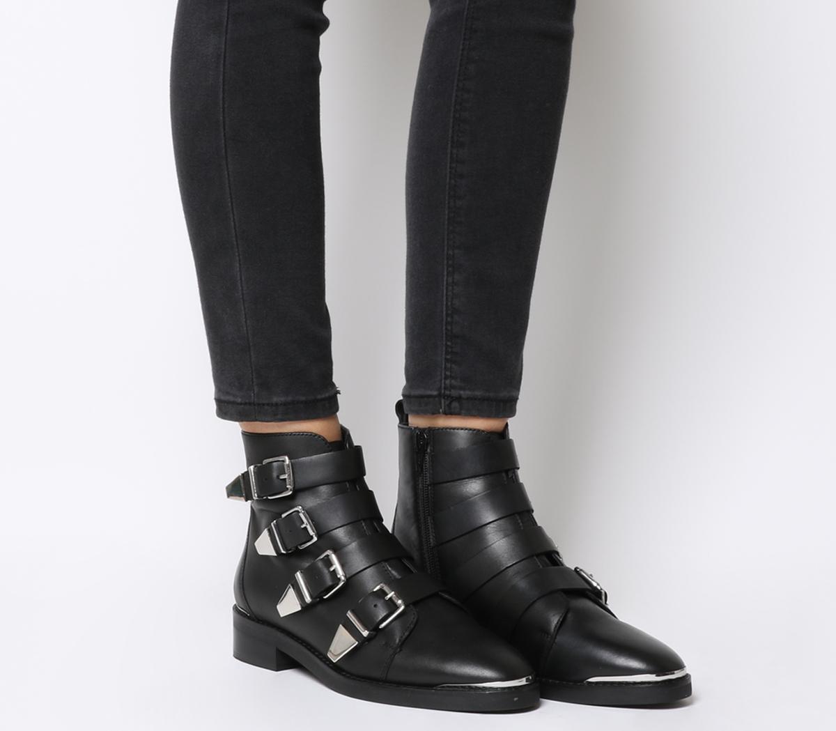 black leather boots with buckles