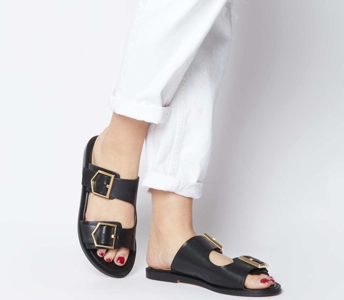 black shoes with gold buckle