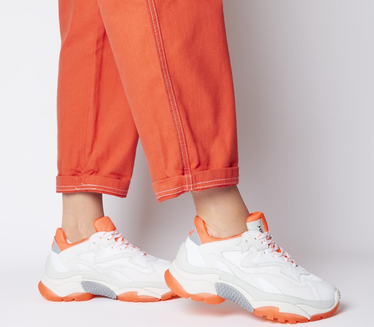 white and orange trainers