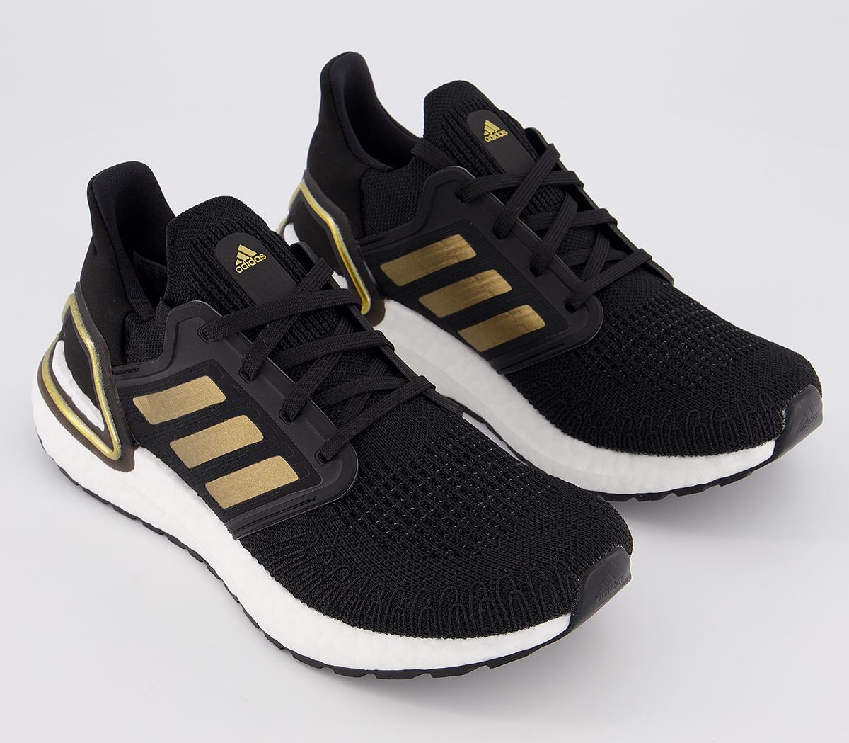 Black gold adidas trainers