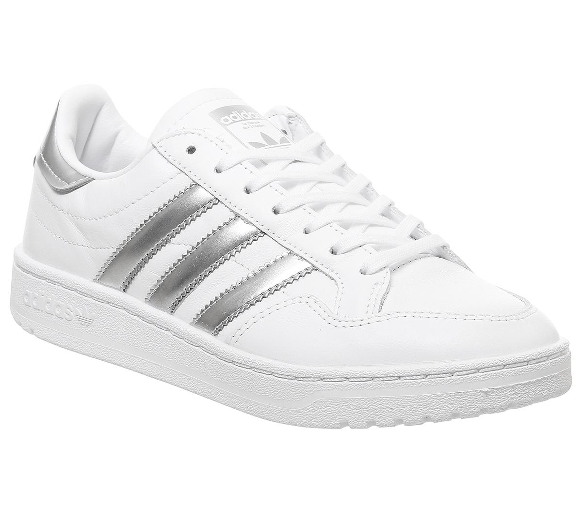 white and silver adidas trainers