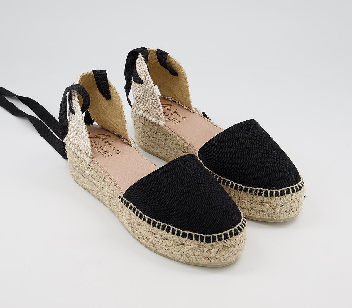 flat black sandals with ankle ties