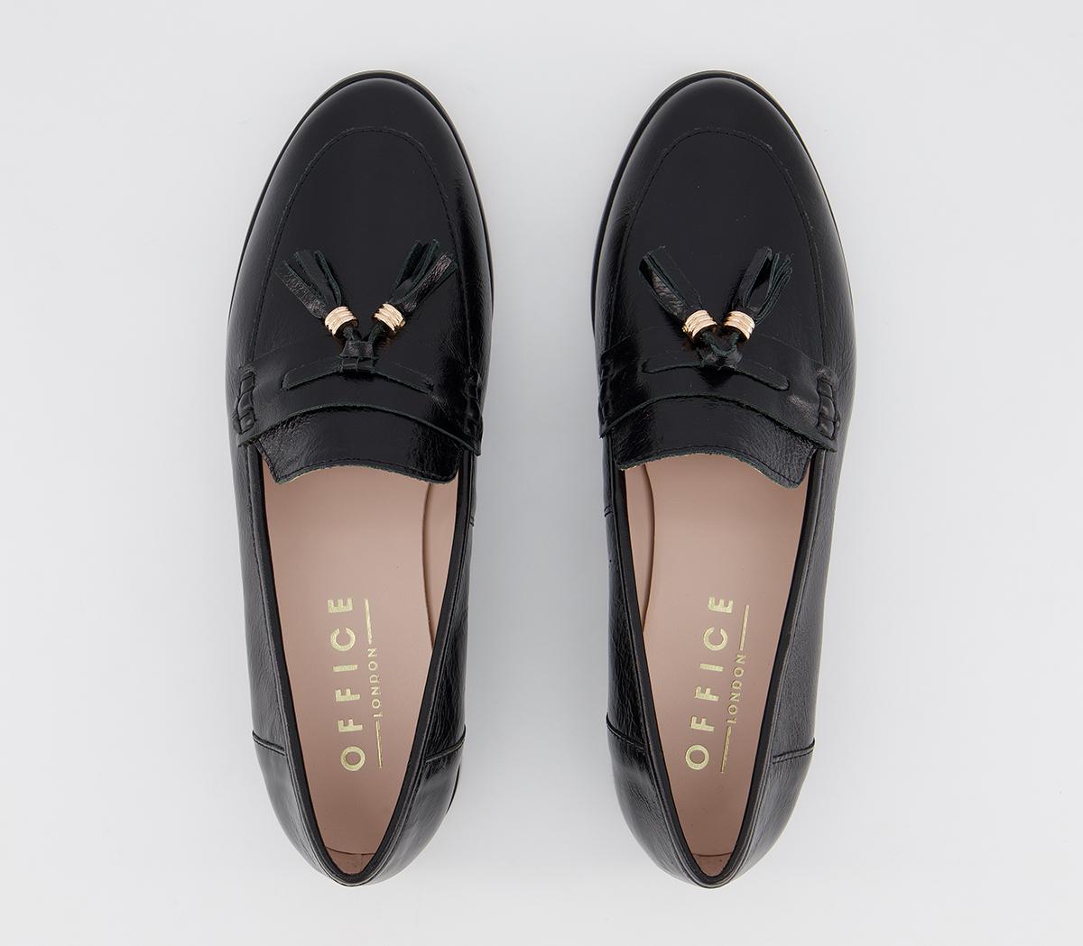 black flats with tassels
