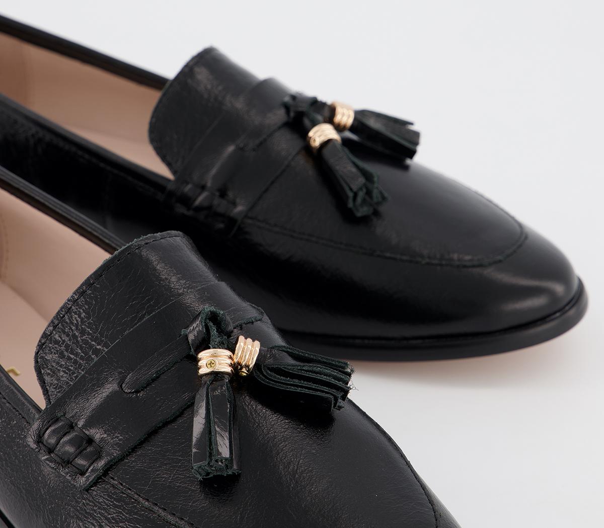 black flats with tassels