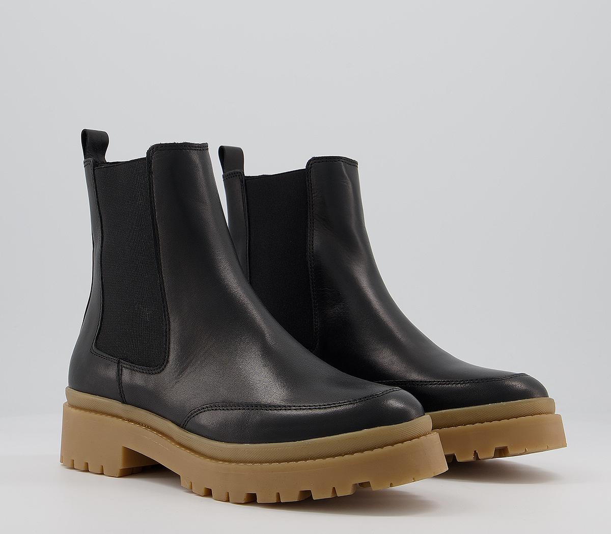 black chelsea boots brown sole