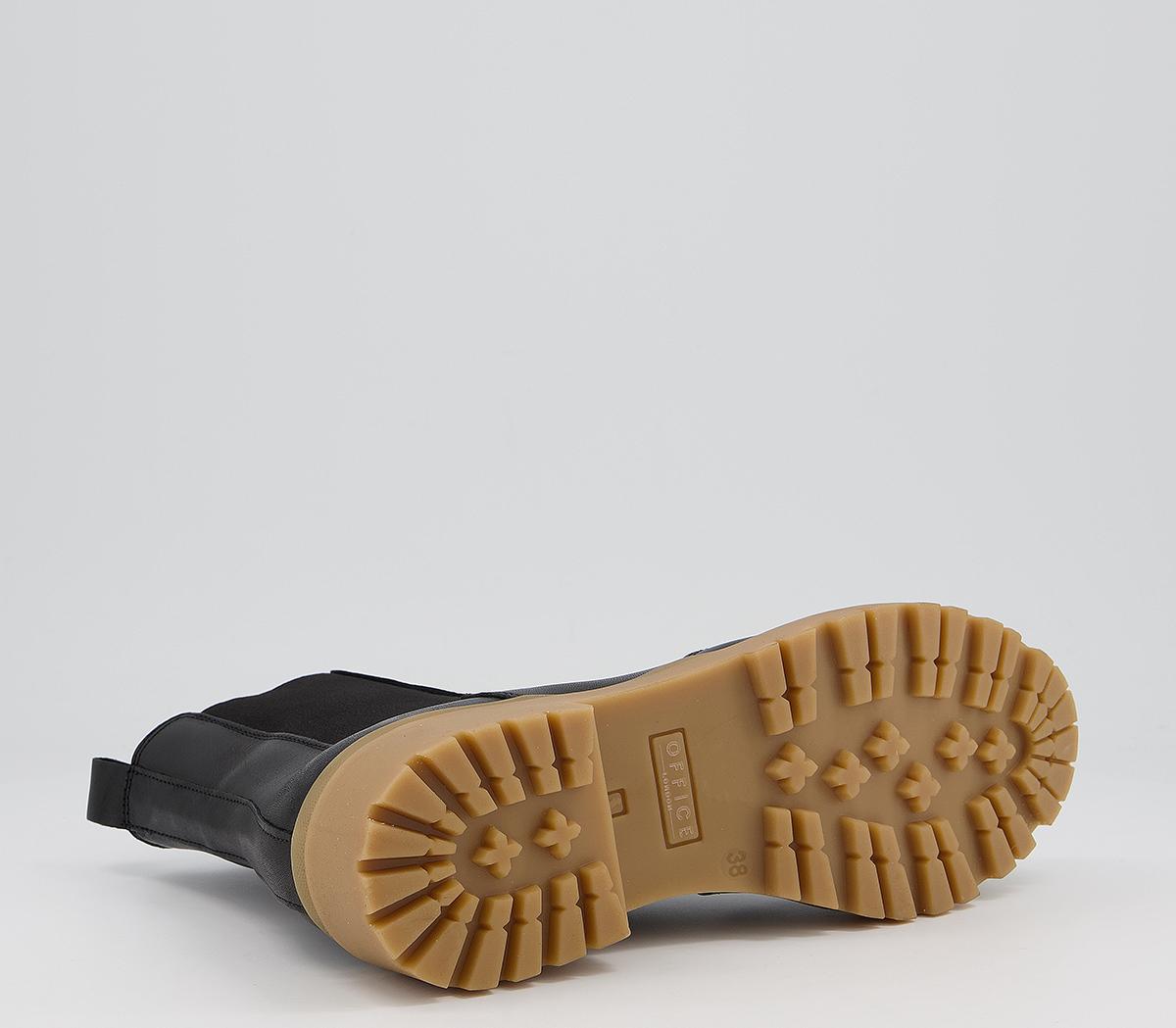 black chelsea boots brown sole