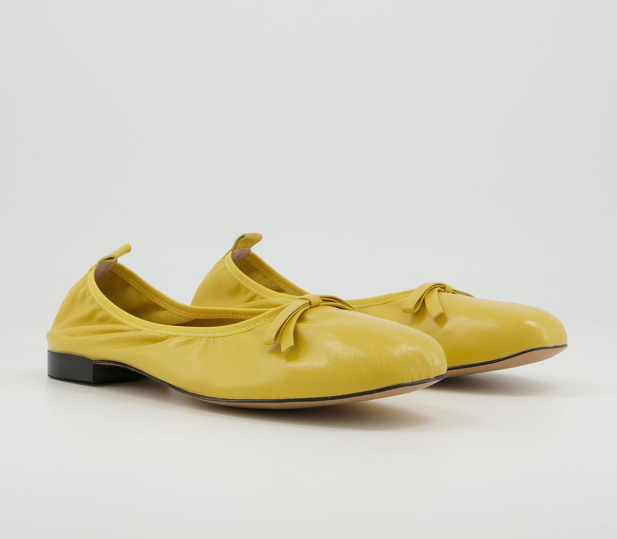 yellow flats with bow