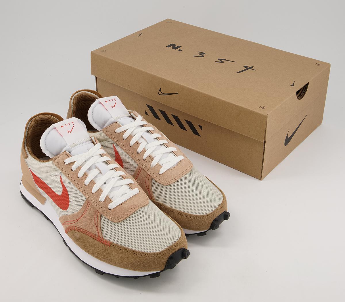 nike daybreak trainers in off white and orange rust
