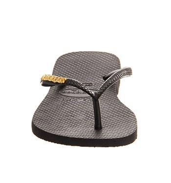 black havaianas with gold logo