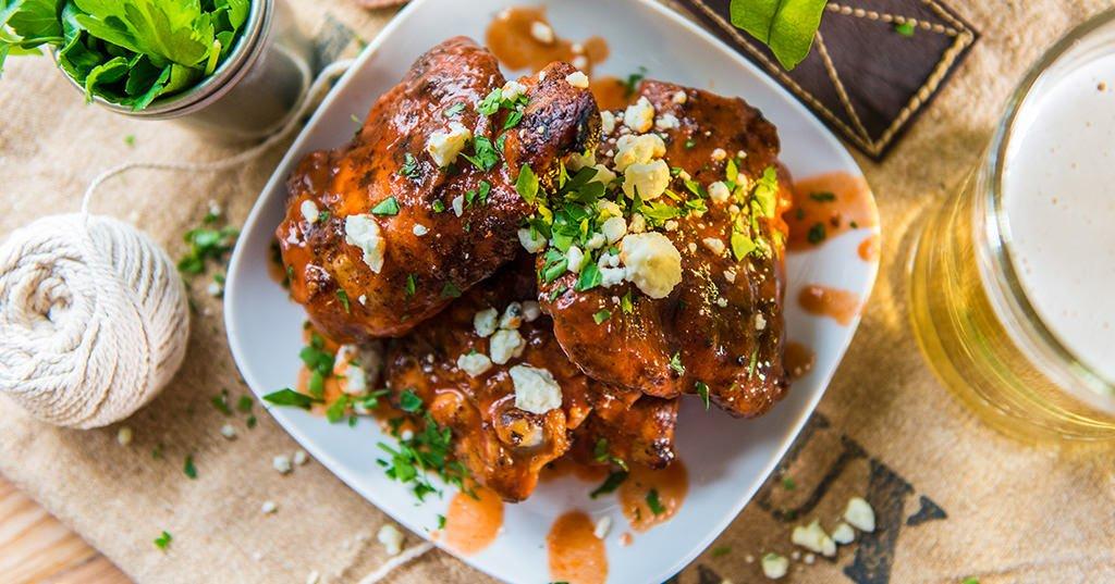 Crispy Chicken Thighs with Buffalo Sauce Traeger Grills